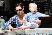 Minnie Driver, blue and white striped top, turquoise dangle earrings, sunglasses,